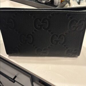 New, never used  Gucci jumbo Black Men's leather clutch Bag
